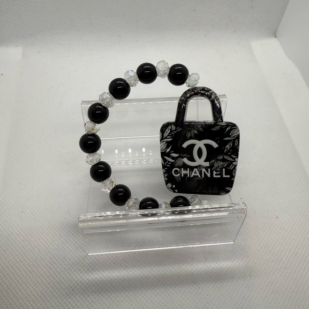 Black and White Beaded Bracelet with Logo Charm